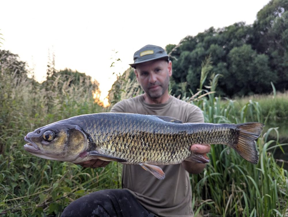 Chris Morton holding a 4lb 1oz chub at Stanground Backwater